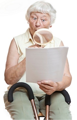 senior with magnifying glass